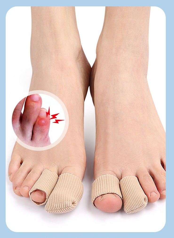 A pair of beige ribbed toe separators worn on a person's toes, shown against a white background with a circular inset demonstrating a painful swollen big toe.